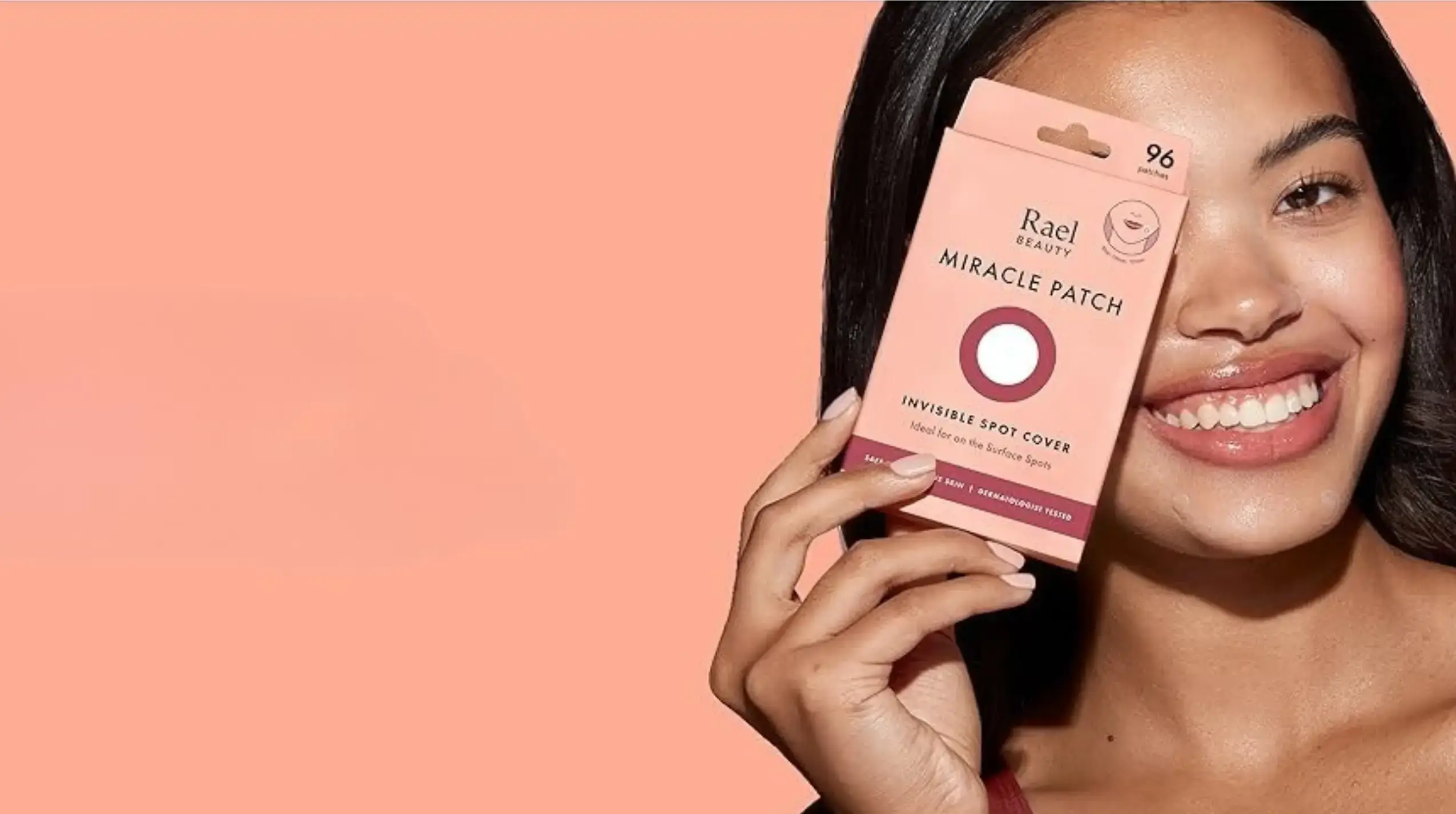 Woman holding a Rael Beauty Miracle Patch Invisible Spot Cover pack of 96 hydrocolloid patches